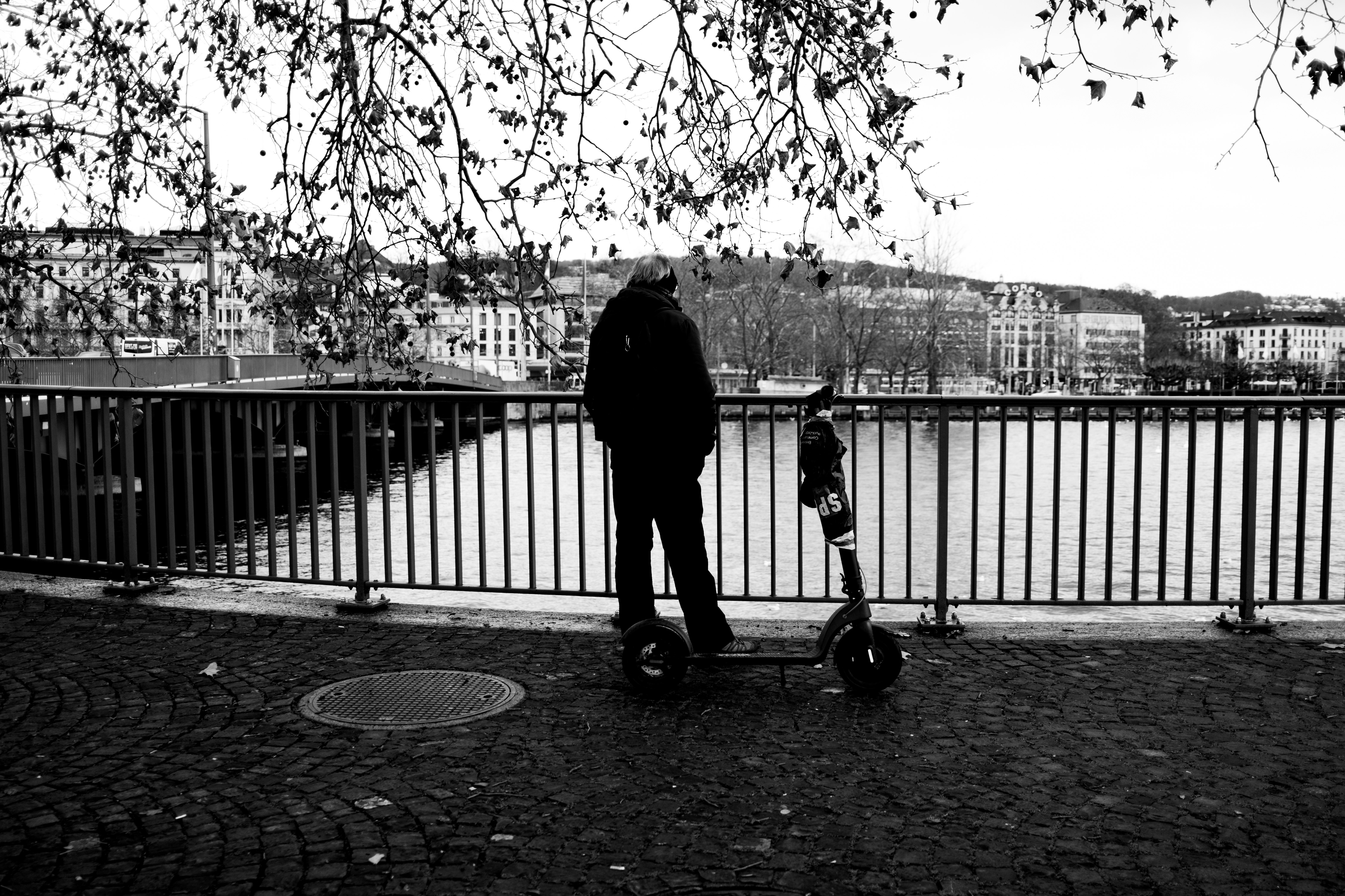 grayscale photo of person walking on pathway